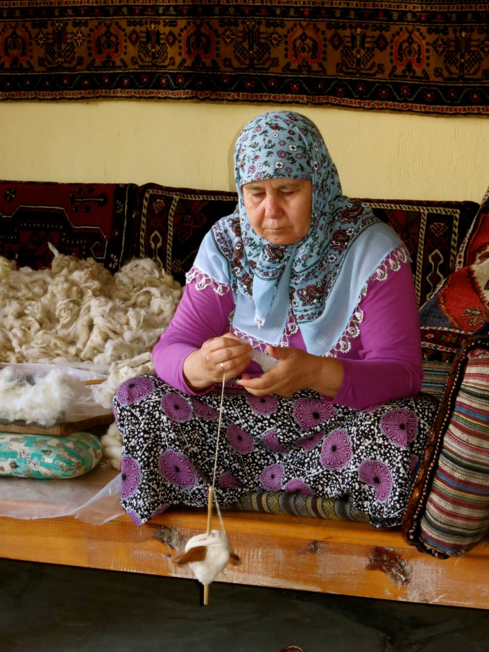 Spinning her wool